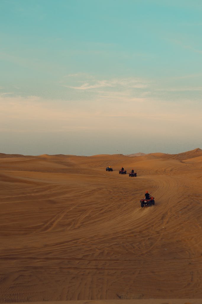 Quads Driving in Sand Dunes