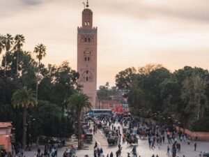 a large group of people walking around a plaza